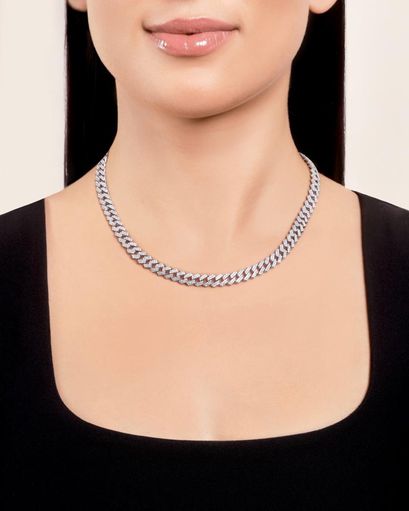woman showcasing Don Roberto Jeweler's silver necklace