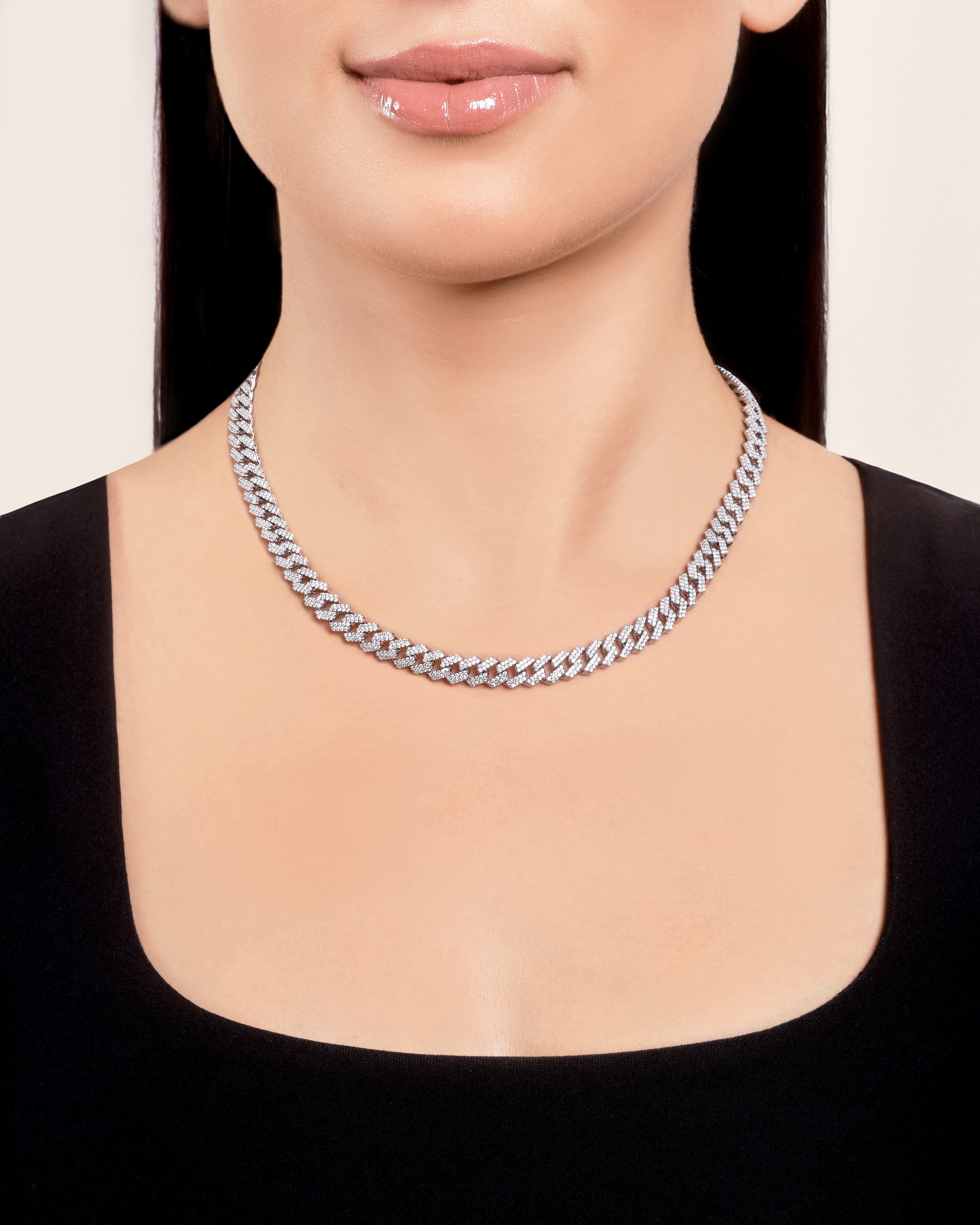 woman showcasing Don Roberto Jeweler's silver necklace